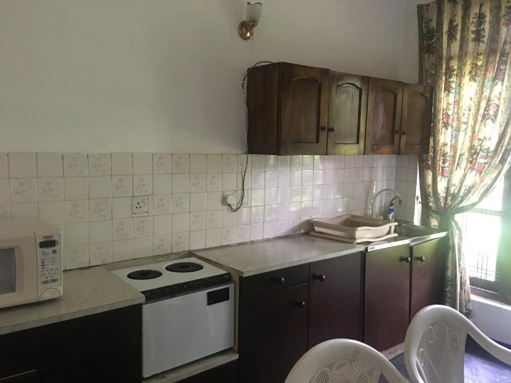 Kuchyň nebo kuchyňský kout v ubytování Araliya Home Stay