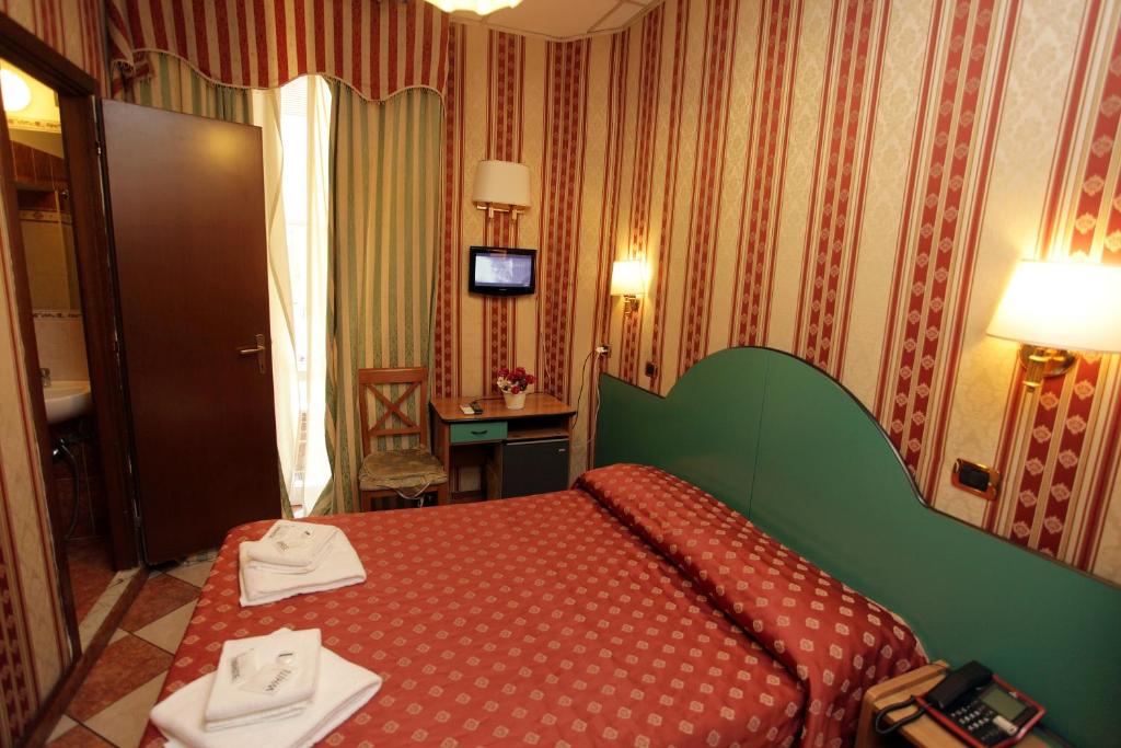 Postel nebo postele na pokoji v ubytování Hotel Hollywood