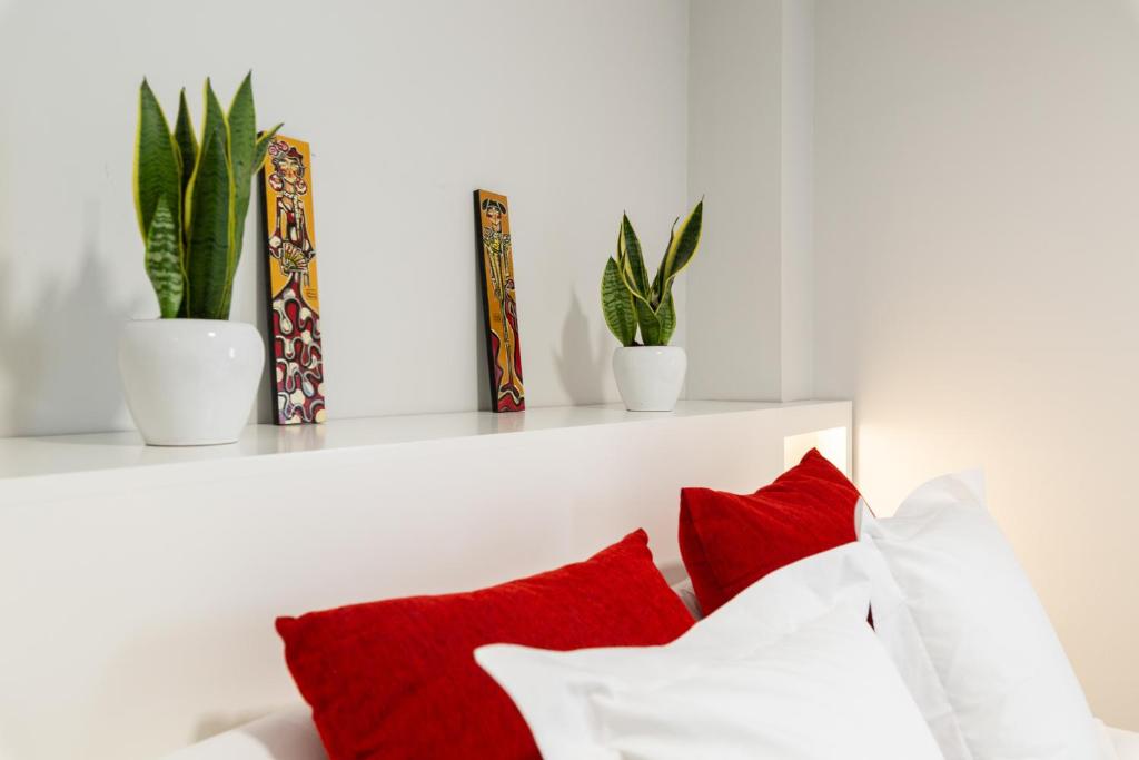Łóżko lub łóżka w pokoju w obiekcie Apartamentos Circulo De Artistas