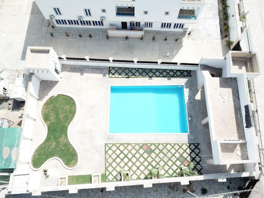 an overhead view of a swimming pool in a building at Porto Golf Hotels in Kano