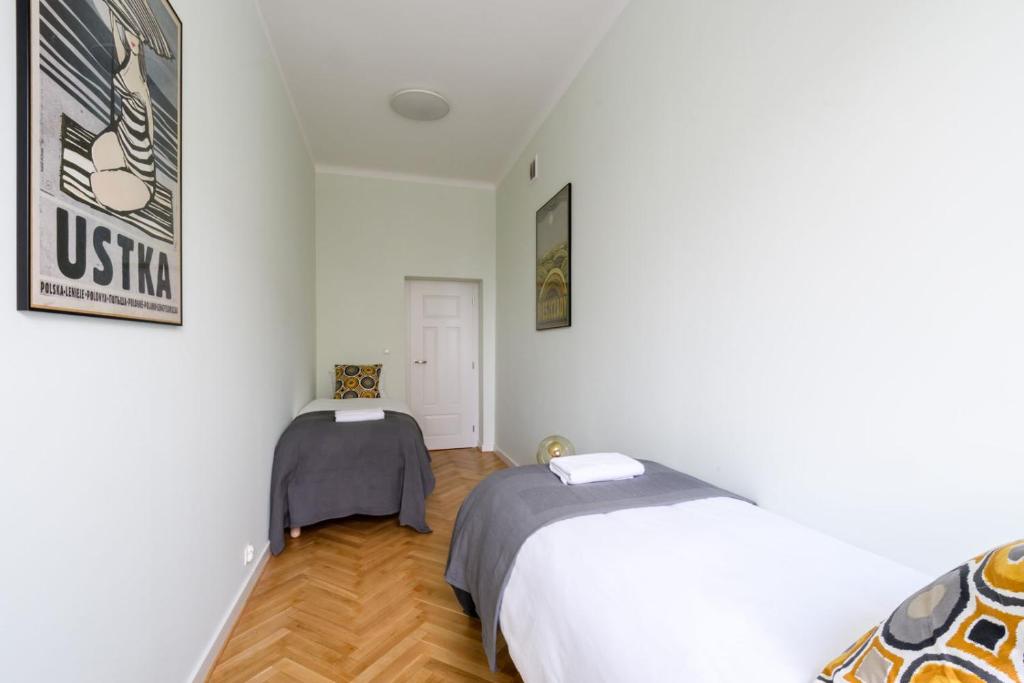 Posteľ alebo postele v izbe v ubytovaní Warsaw City Center P&O Serviced Apartments