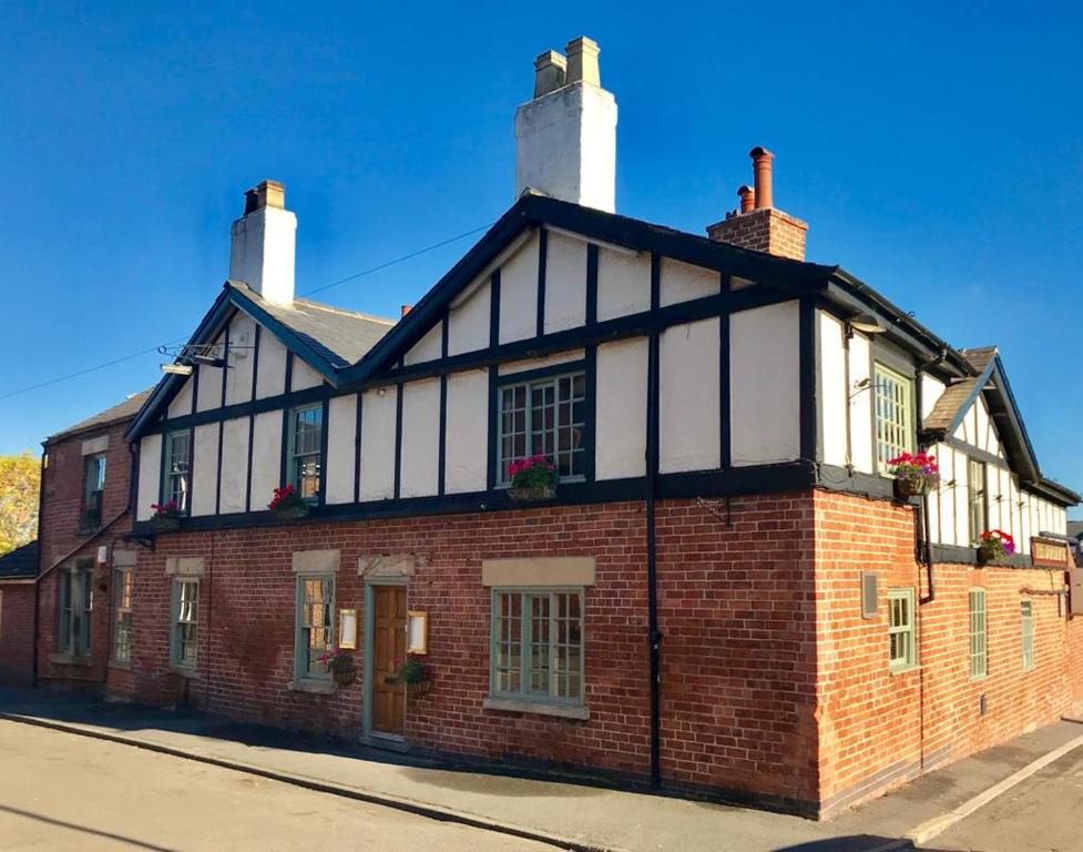 an old brick building on a street at Durham Ox Ilkeston in Derby