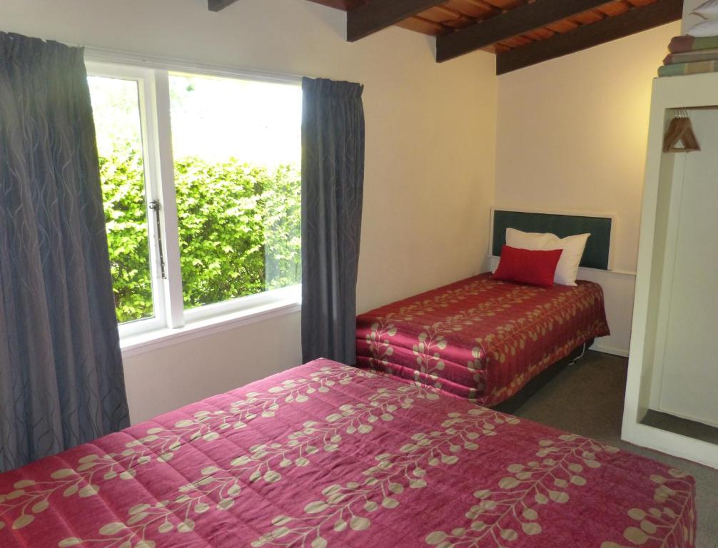 Postel nebo postele na pokoji v ubytování Spa Lodge Motel