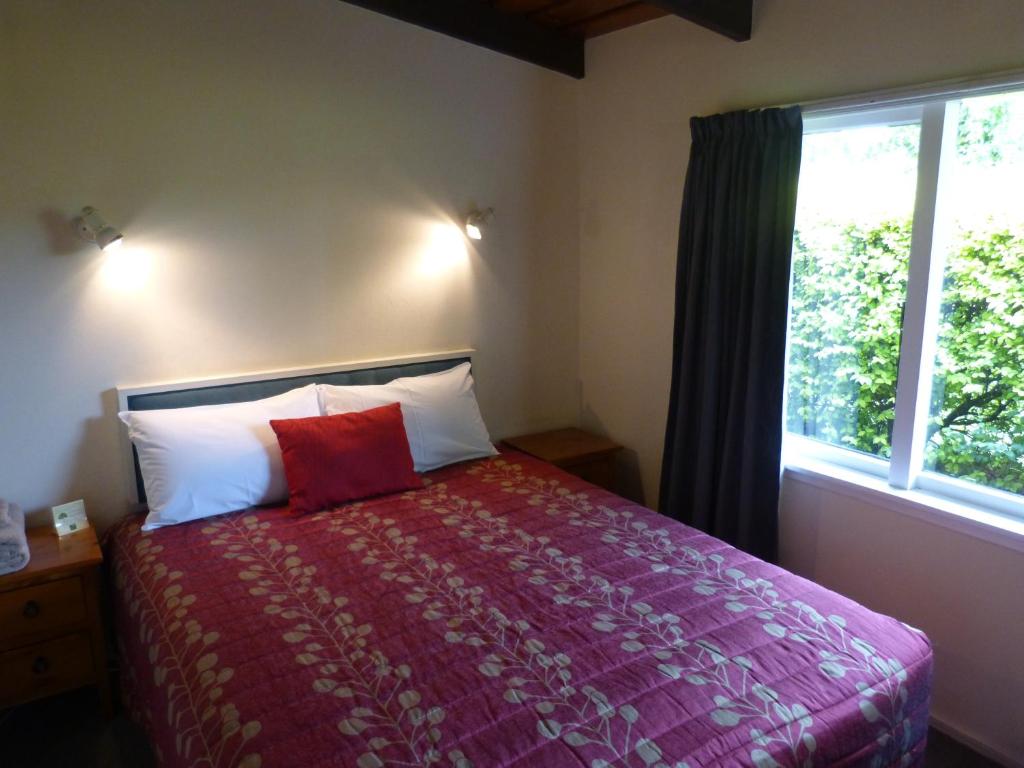 Postel nebo postele na pokoji v ubytování Spa Lodge Motel