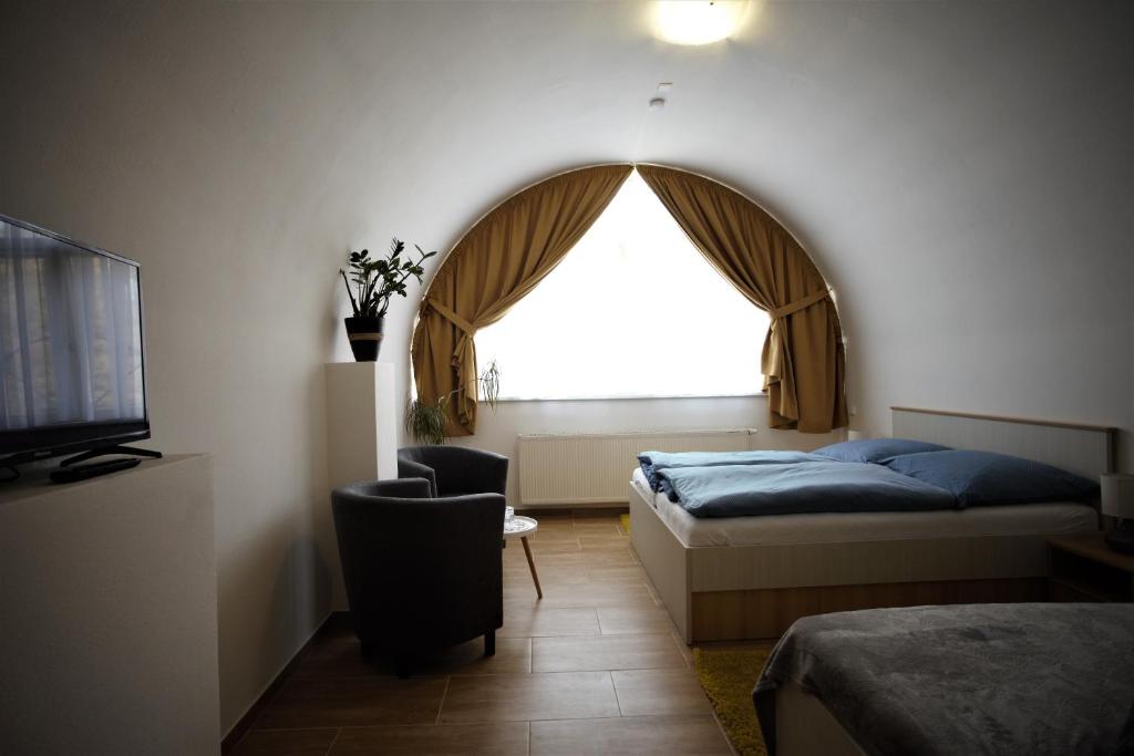 Postel nebo postele na pokoji v ubytování Penzion u Pidly