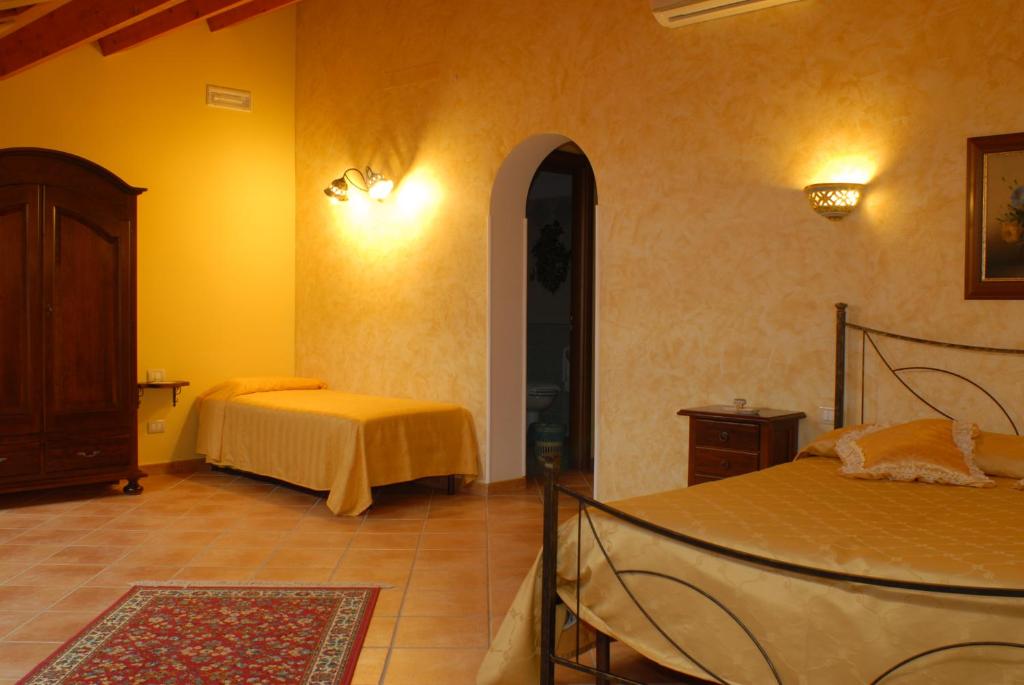 Postel nebo postele na pokoji v ubytování B&B Triskèles