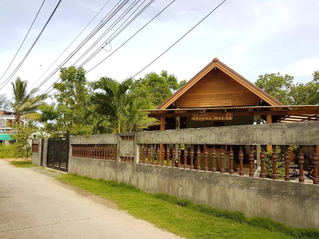 a building on the side of a road at Asiana House in Khao Lak