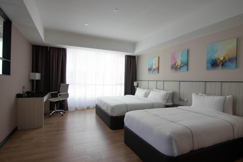 Postel nebo postele na pokoji v ubytování Higher Hotel