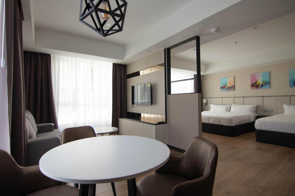 Postel nebo postele na pokoji v ubytování Higher Hotel