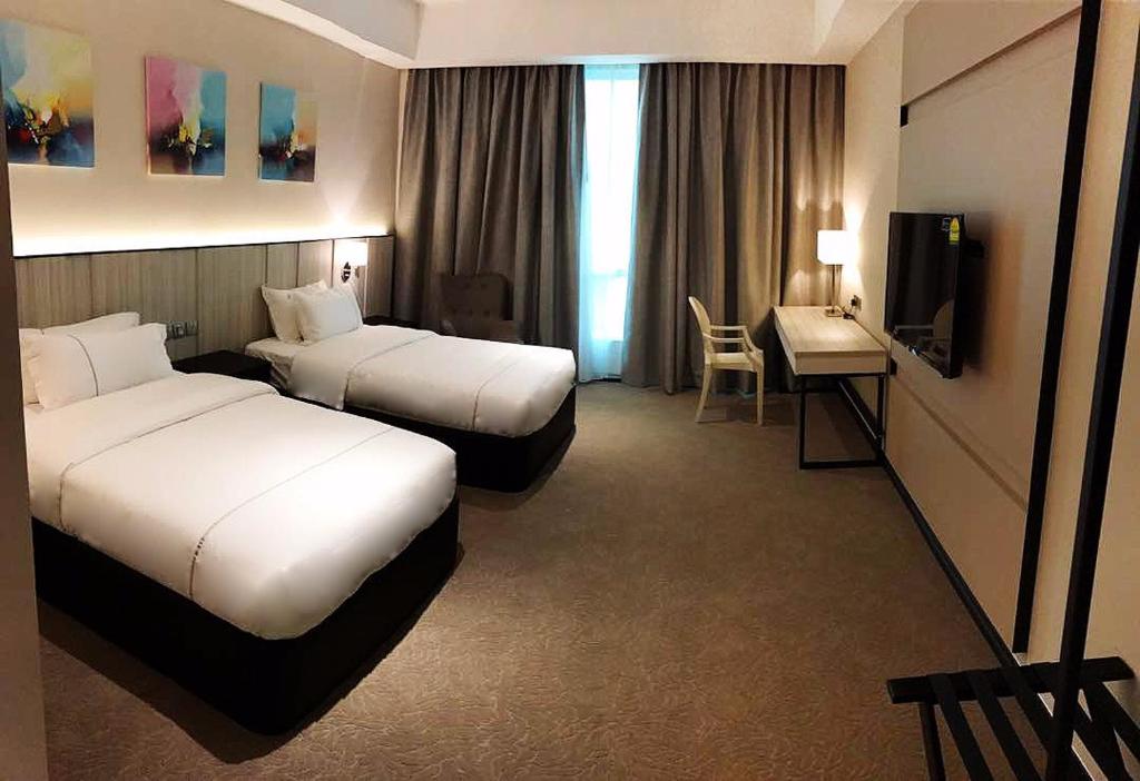 Postel nebo postele na pokoji v ubytování Higher Hotel