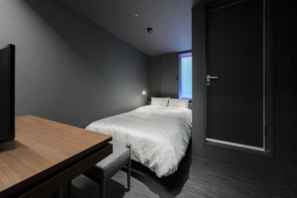 Postel nebo postele na pokoji v ubytování Hotel Comfact