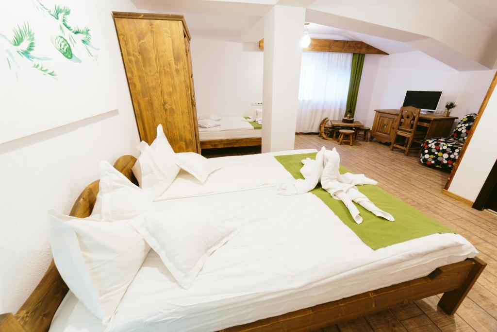 Una cama o camas en una habitación de Hotel Superski