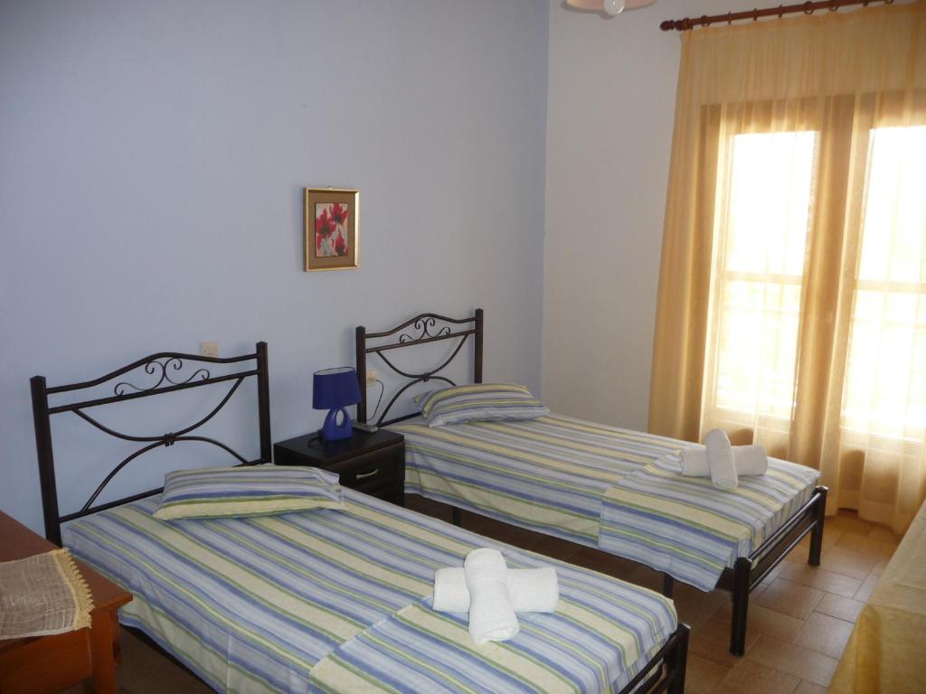 Postel nebo postele na pokoji v ubytování House Evristhenis 1