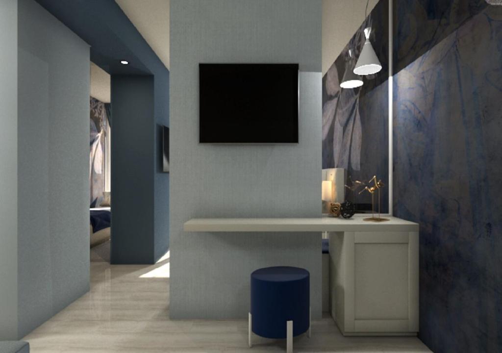 Телевизор и/или развлекательный центр в Hotel Amburgo