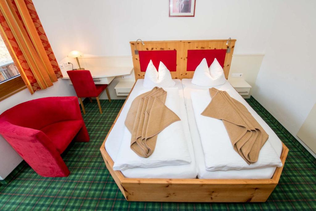 Postel nebo postele na pokoji v ubytování Almhotel Fichtenheim