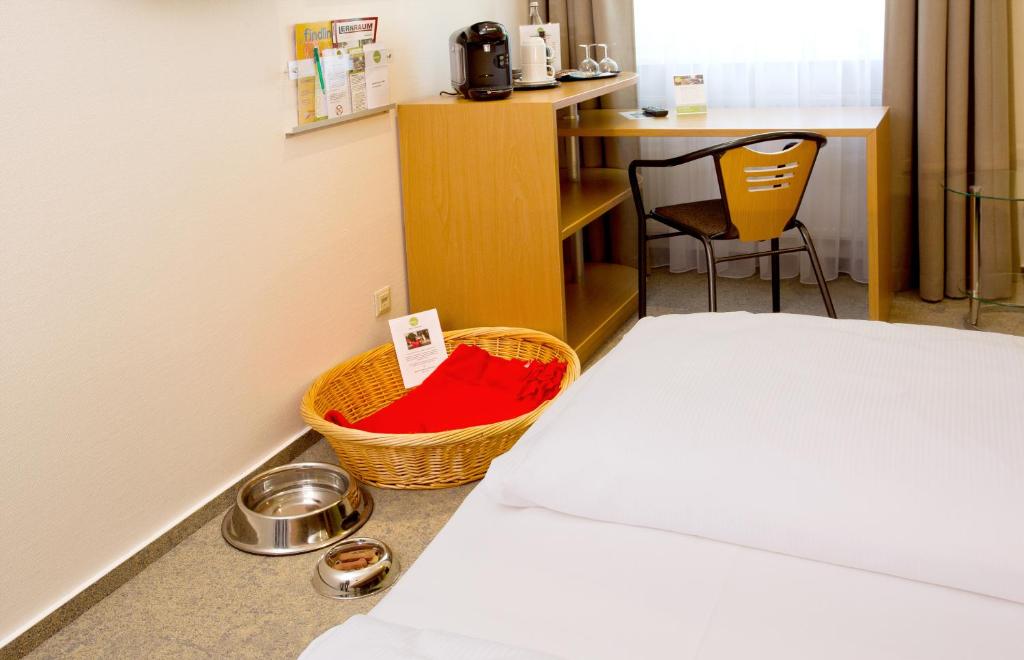 Postel nebo postele na pokoji v ubytování Anders Hotel Walsrode