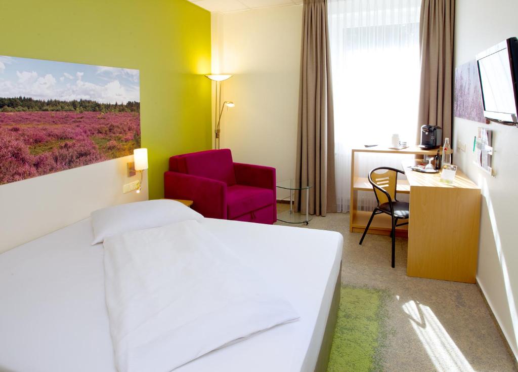TV a/nebo společenská místnost v ubytování Anders Hotel Walsrode
