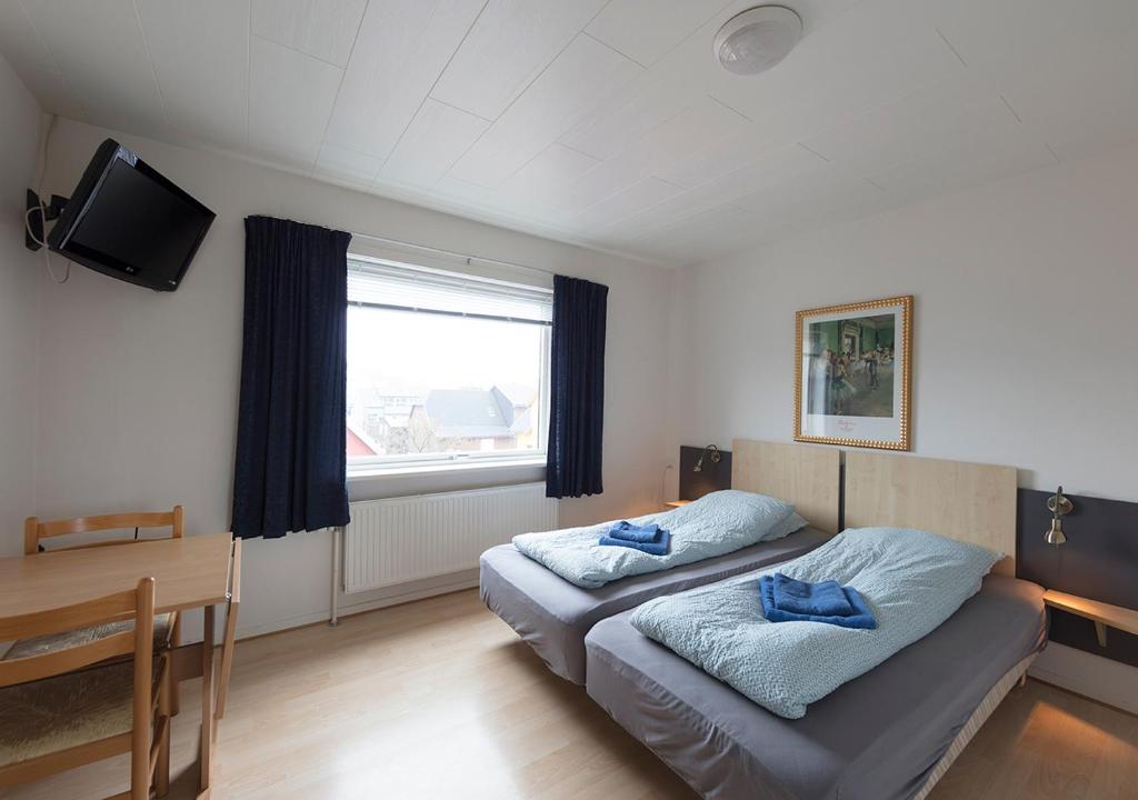 Postel nebo postele na pokoji v ubytování 62N Guesthouse - City Center