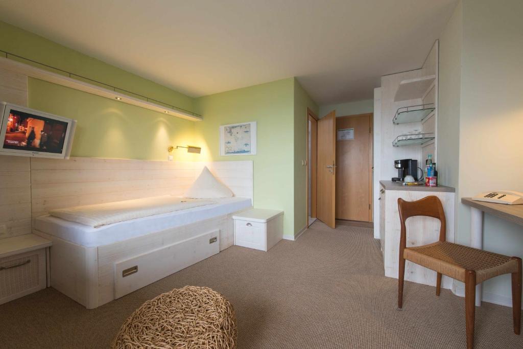 Postel nebo postele na pokoji v ubytování Hotel Rickmers' Insulaner
