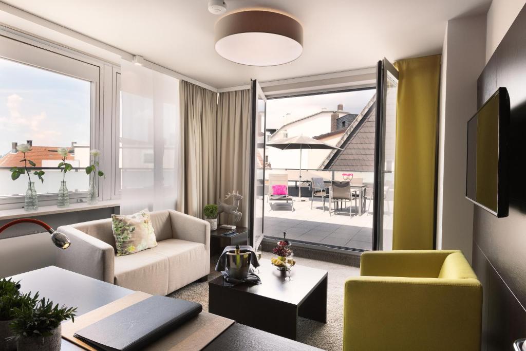 Posezení v ubytování Hotel Platzhirsch
