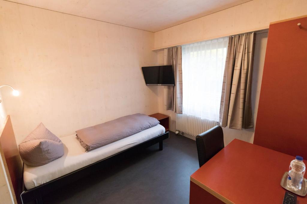 Letto o letti in una camera di Gasthaus Ochsen