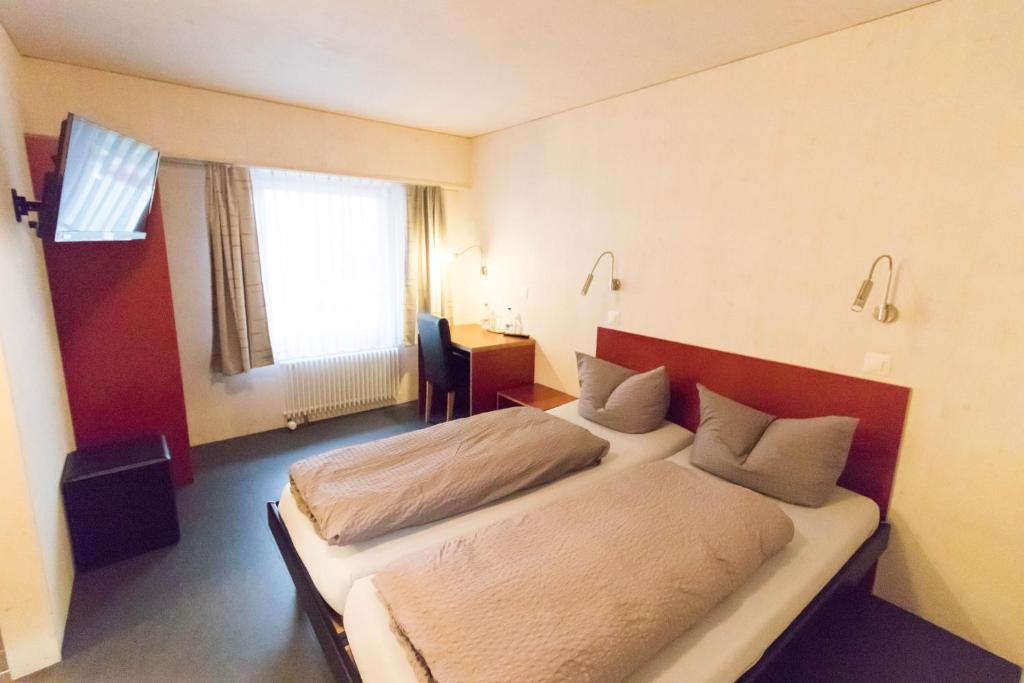 Letto o letti in una camera di Gasthaus Ochsen
