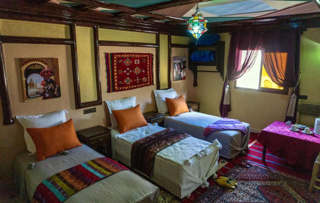 Postel nebo postele na pokoji v ubytování Riad Atlas Panorama