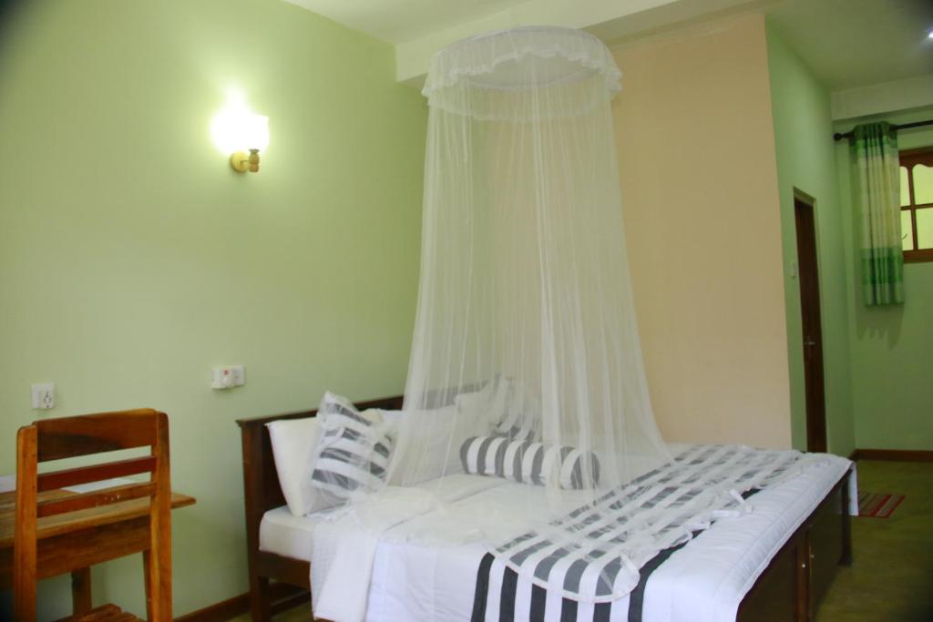 Postel nebo postele na pokoji v ubytování Dinaro Guest