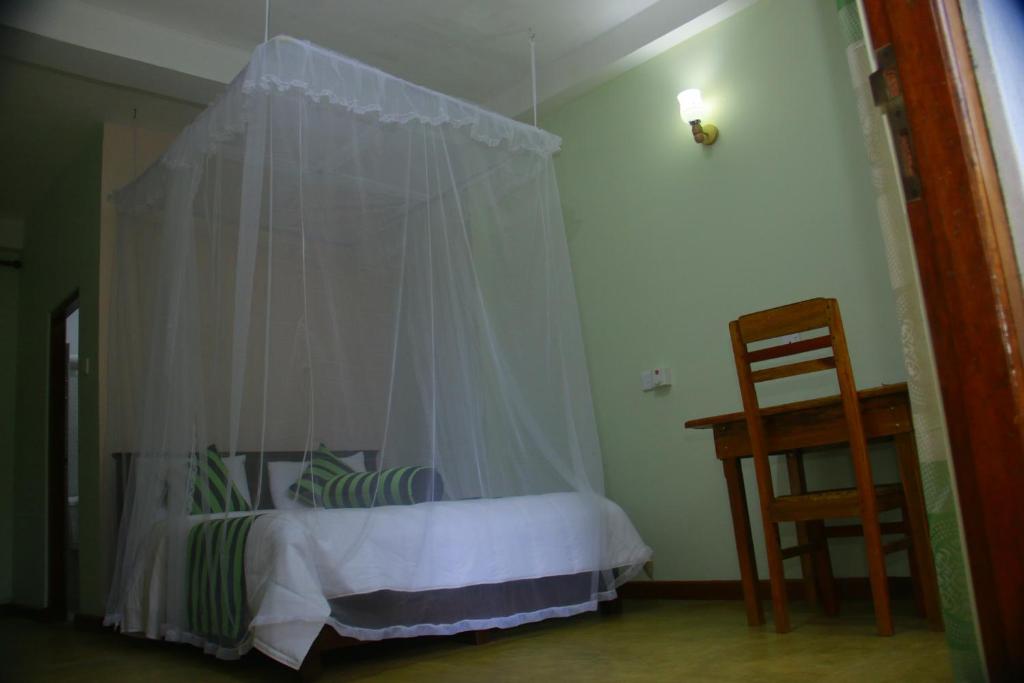 Postel nebo postele na pokoji v ubytování Dinaro Guest