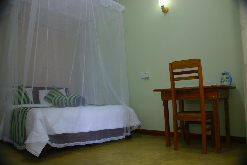 Postel nebo postele na pokoji v ubytování Dinaro Guest