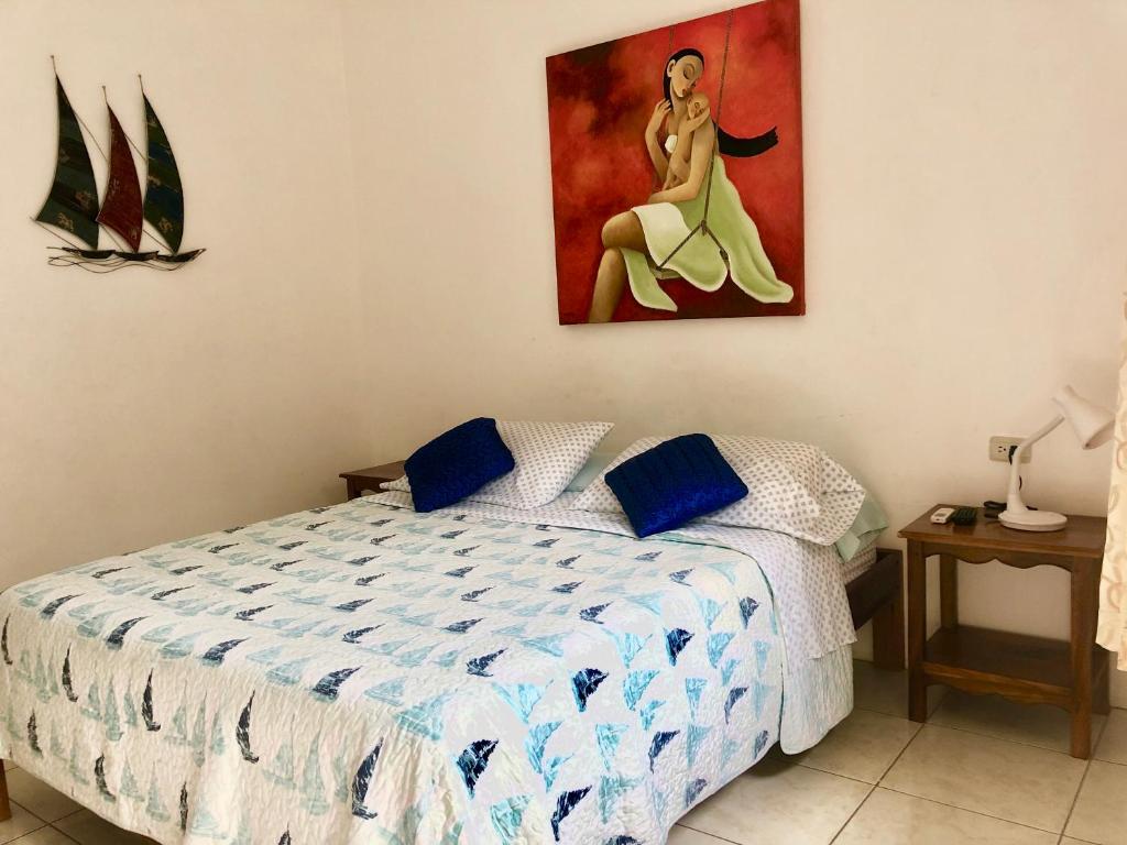Postel nebo postele na pokoji v ubytování Hotel Santorini