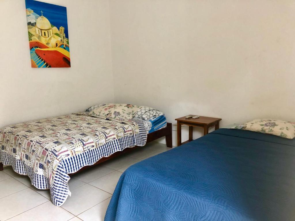 Postel nebo postele na pokoji v ubytování Hotel Santorini