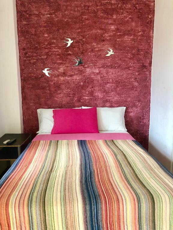 Postel nebo postele na pokoji v ubytování Hotel Santorini