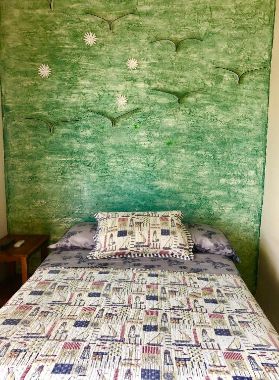Postel nebo postele na pokoji v ubytování Hotel Santorini