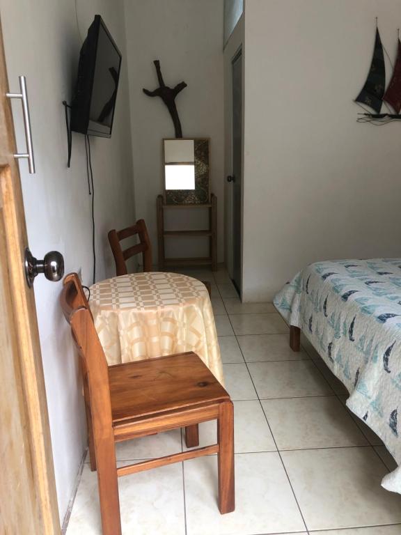 Postel nebo postele na pokoji v ubytování Hotel Santorini