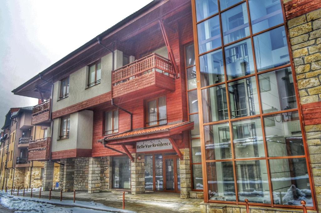 an apartment building with a large window at Bellevue Residence Apartments in Bansko
