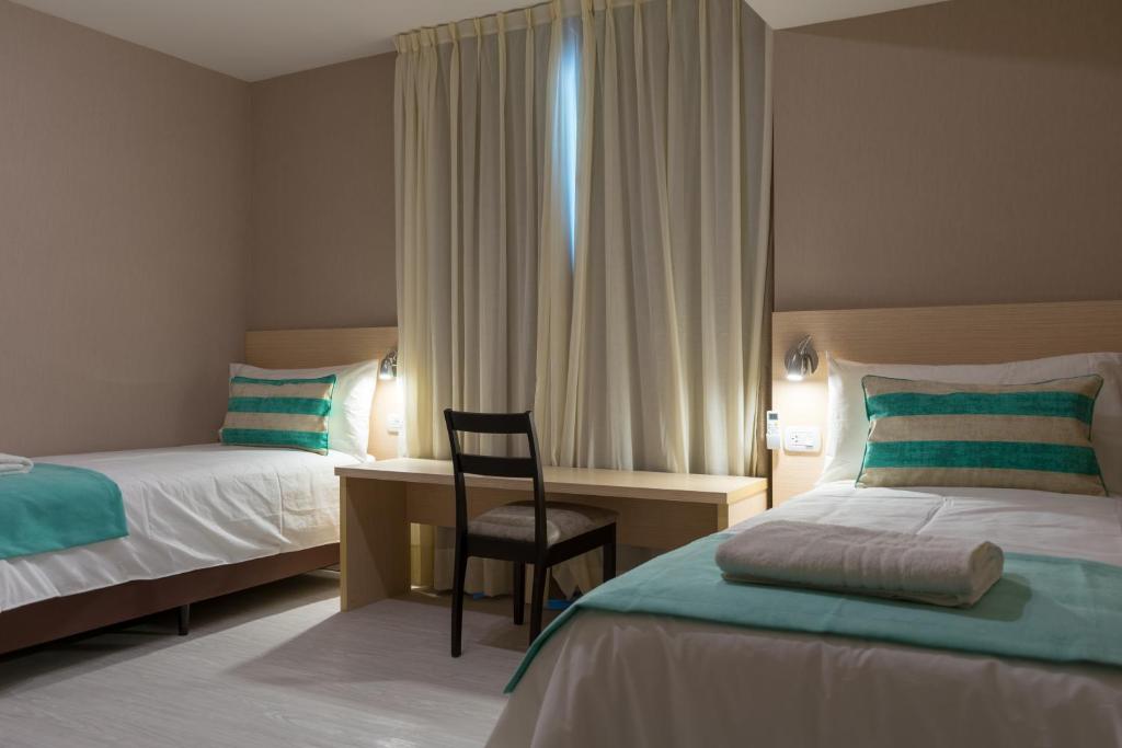 Postel nebo postele na pokoji v ubytování Fuente Mayor Hotel Centro