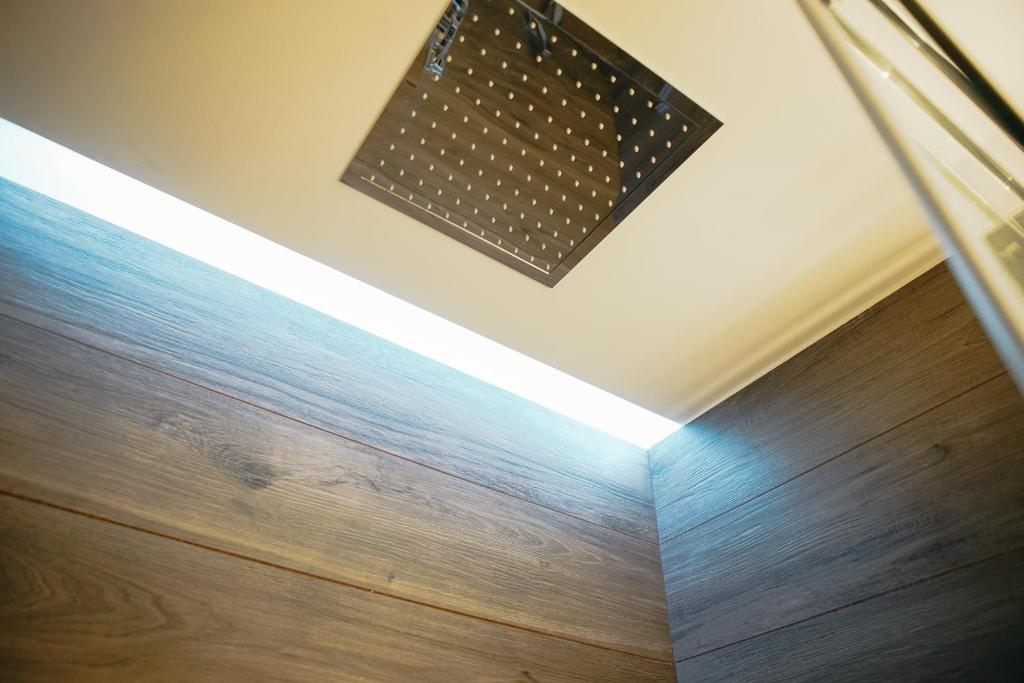 a ceiling light in a room with a wooden floor at Terradamare in Monopoli