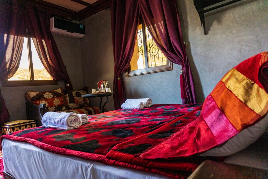 Postel nebo postele na pokoji v ubytování Riad Atlas Panorama