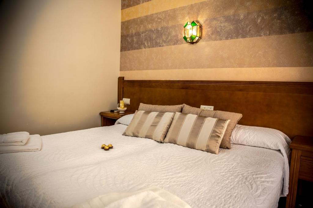 Postel nebo postele na pokoji v ubytování Hostal Tic-Tac