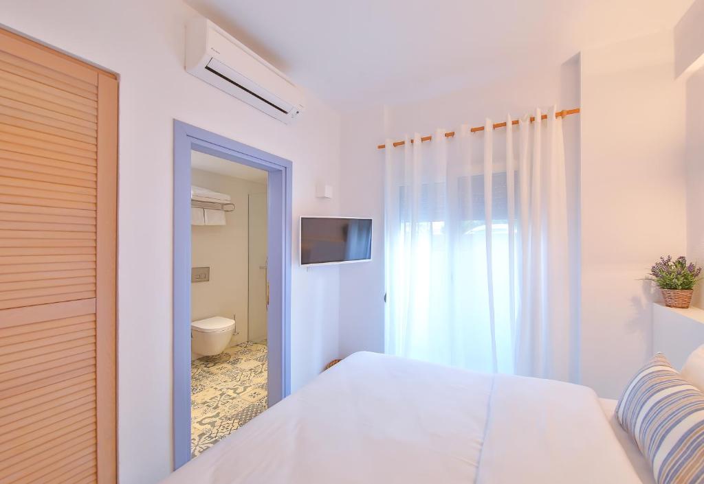 Postel nebo postele na pokoji v ubytování Dias Hotel