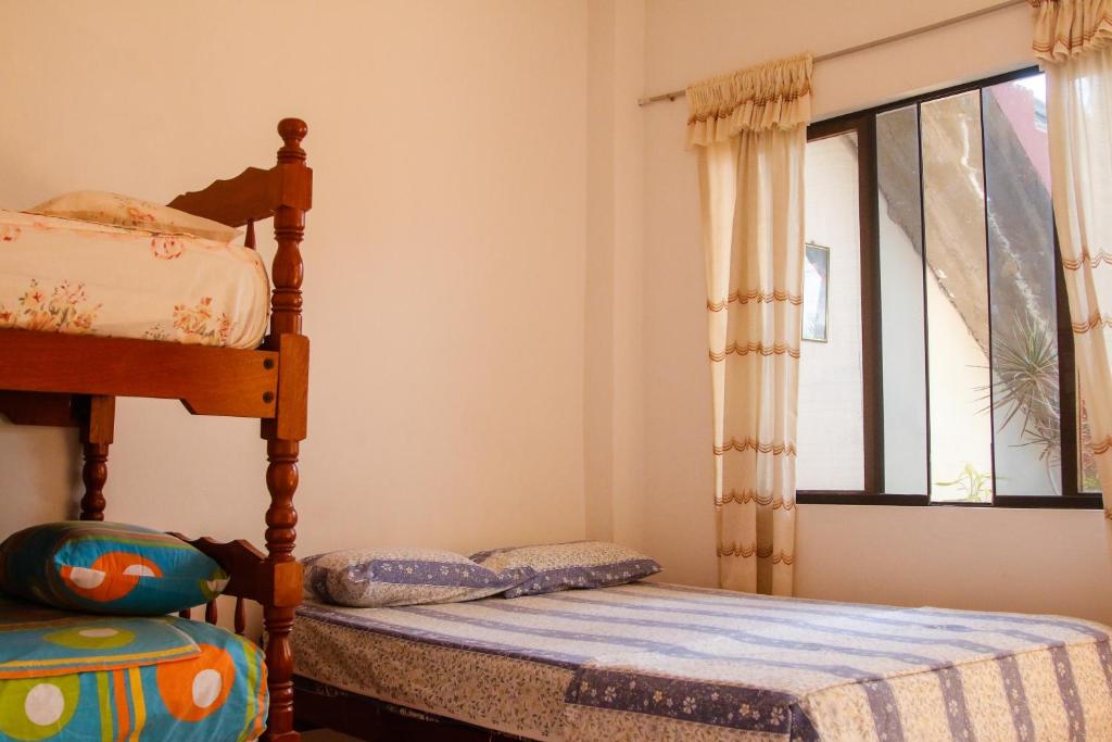 Postel nebo postele na pokoji v ubytování Hospedaje Costa Norte