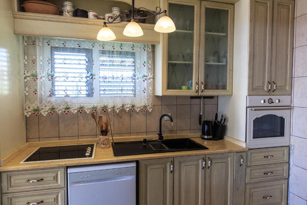 Kuchyň nebo kuchyňský kout v ubytování Zen Luxury Villa