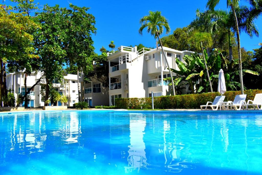 a large swimming pool in front of a building at Tropical Casa Laguna in Cabarete