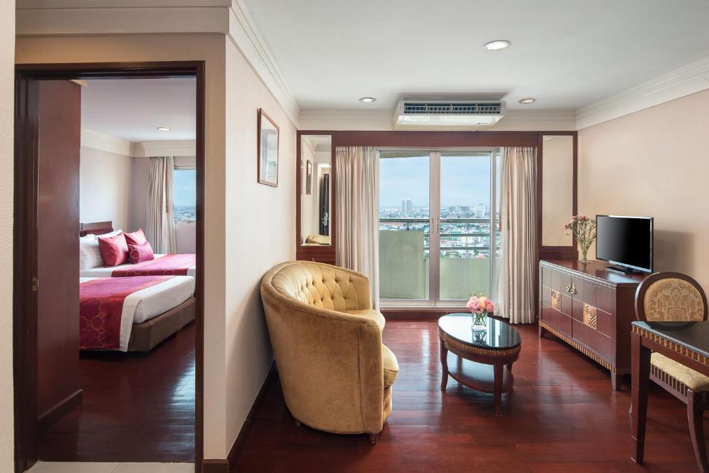 Postel nebo postele na pokoji v ubytování Prince Palace Hotel Bangkok