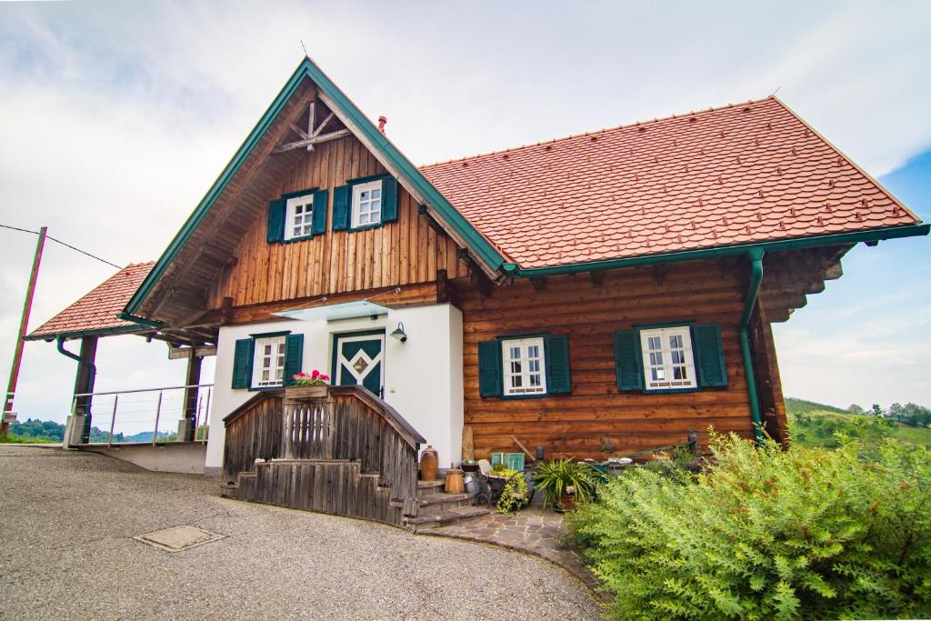 a wooden house with a brown roof at Kellerstöckl in Leutschach