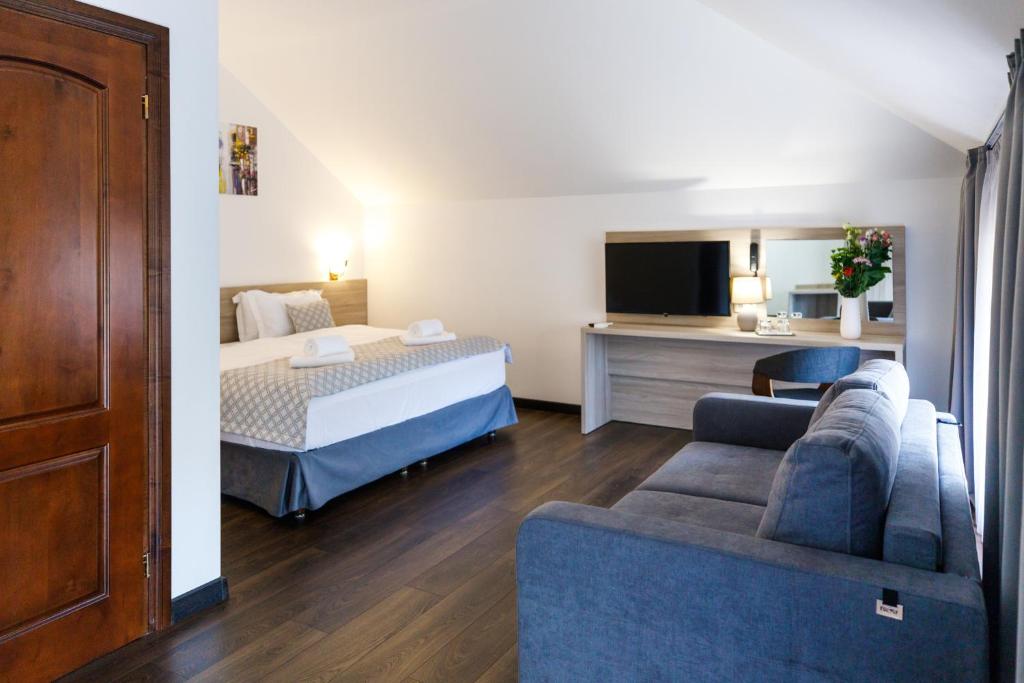 Postel nebo postele na pokoji v ubytování Hotel Antonio