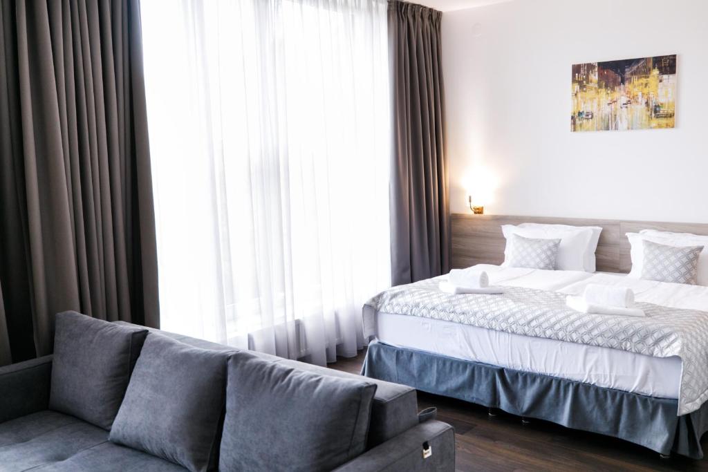 Postel nebo postele na pokoji v ubytování Hotel Antonio