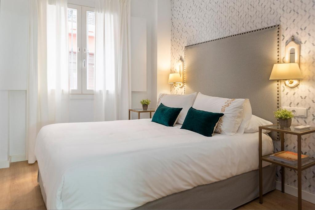 Posteľ alebo postele v izbe v ubytovaní Genteel Home Baños