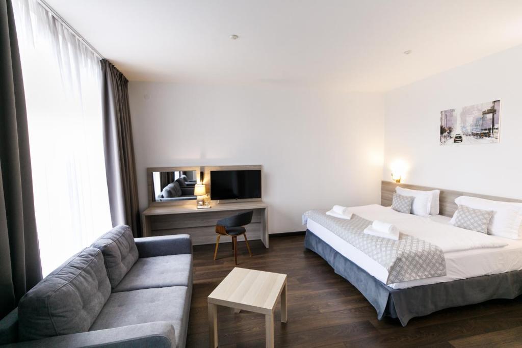 Postel nebo postele na pokoji v ubytování Hotel Antonio